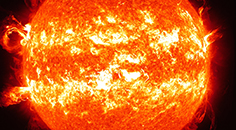 bright orange image of the Sun with two yellow circular stripes of higher temperature