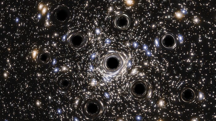 a starry background with many star positions warped and bent by several black spots representing black holes