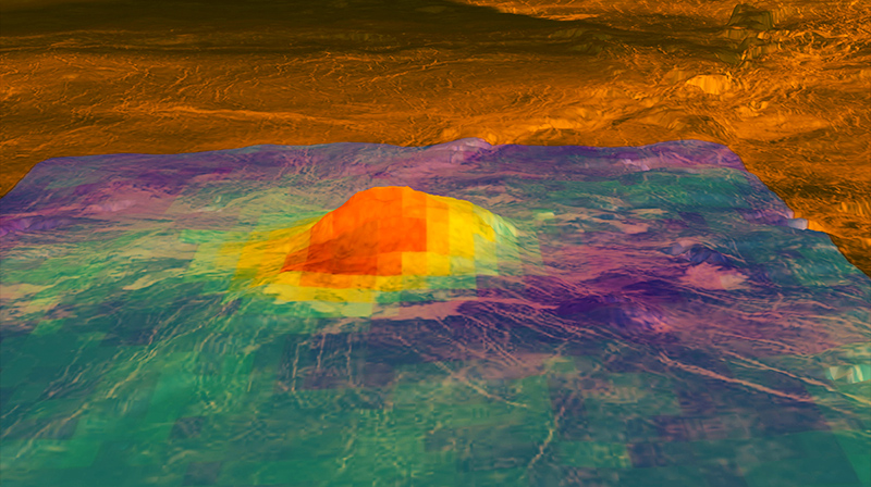 mountain on Venus against the orange-colored Venusian landscape. The mountain's heat pattern and the pattern across the surrounding plain is shown by color coding