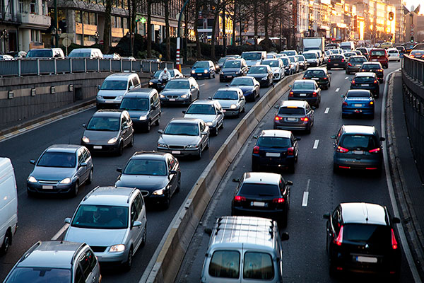 car traffic on an urban asphalt-paved roadway