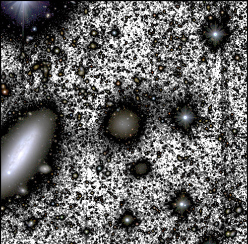 luminous blobs of varying sizes that look like and are in fact galaxies, interspersed by white instead of black representing space where a luminous galaxy is not in view
