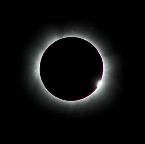 photo of Earth completely obscuring the Sun, except for a bright outline around the Earth and a totally black background