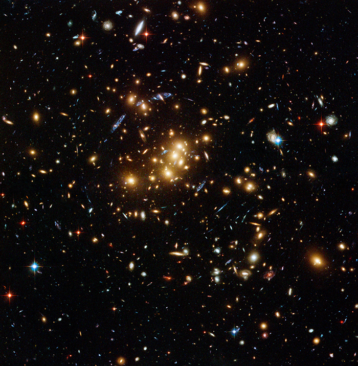A sea of galaxies, showing many spiral and elliptical galaxy types, in an image from the Hubble Space Telescope. 