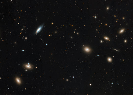 Numerous galaxies in a cluster in the constellation Coma.
