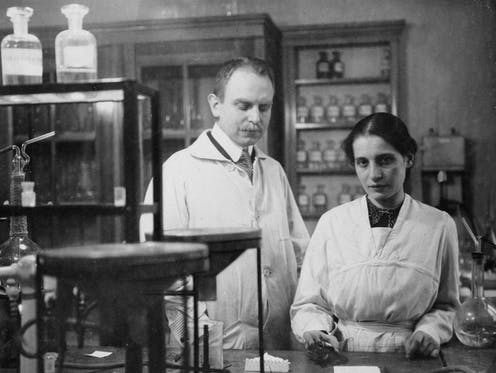 black-and-white photographs of Otto Hahn and Lise Meitner working in their lab