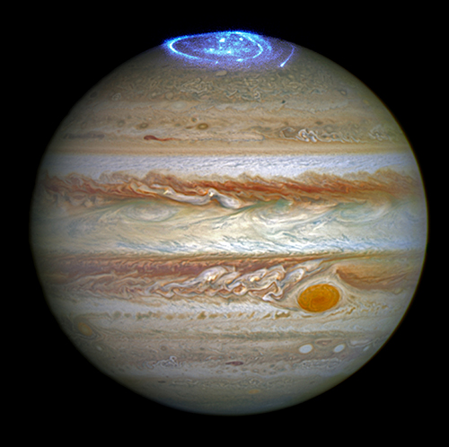 Hubble Space Telescope images of Jupiter in visible light and aurora at its north pole captured in ultraviolet light, given a representative contrasting color in this image. 